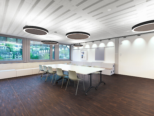 Salle de réunion lumineuse avec grande table et luminaires suspendus Ringo Star