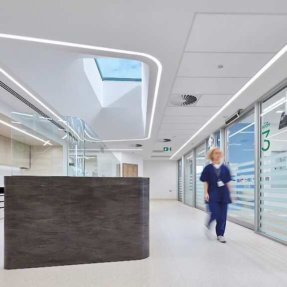 Reception at The Bays Hospital in Mornington with curved Liquid Line recessed luminaires by Lightnet.