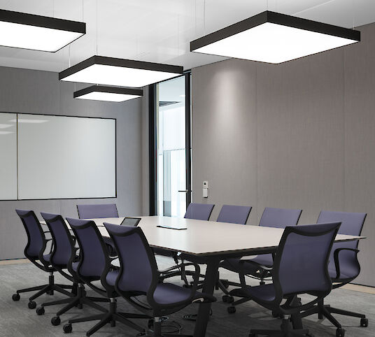 Meeting room with rectangular table, swivel chairs and square Cubic Evolution pendant luminaires.