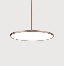 Minimalist, round pendant luminaire with a thin, bronze-coloured frame that shines in a neutral white. The luminaire is suspended from a narrow rod and is set against a neutral, light grey background.