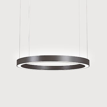 A modern, ring-shaped pendant luminaire with a slender, black frame. The luminaire is suspended by thin wires and emits a diffuse, soft light downwards. The background is plain grey and draws the eye to the elegant luminaire.