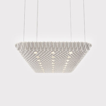 A large, rectangular acoustic pendant luminaire suspended from the ceiling by four thin cables. The surface of the luminaire has a structured, wave-like texture and is finished in a light colour. Several small, evenly distributed points of light are integrated into the design and provide discreet lighting. 